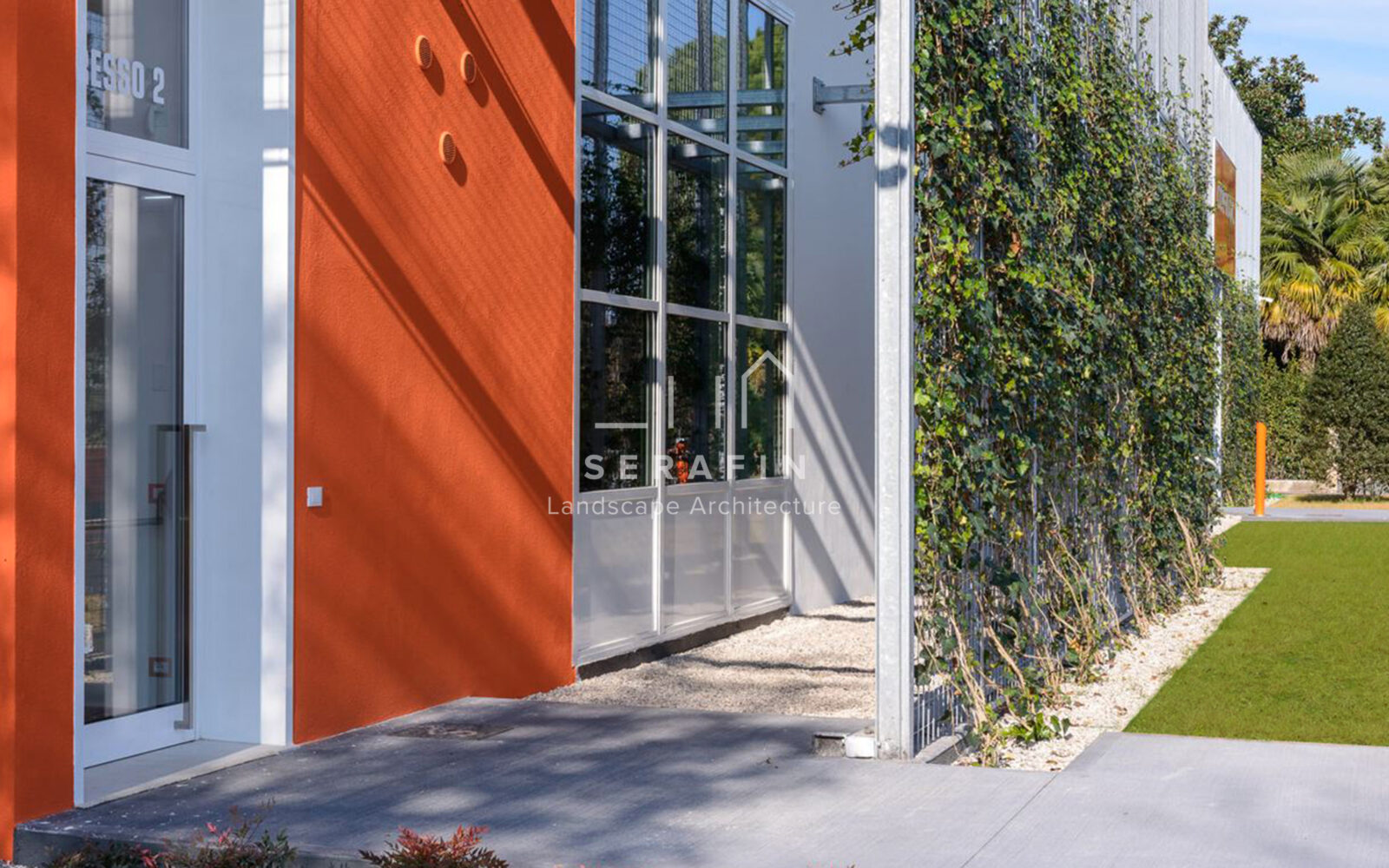 corporate green space with lawn, flower beds and a vertical green wall - 2