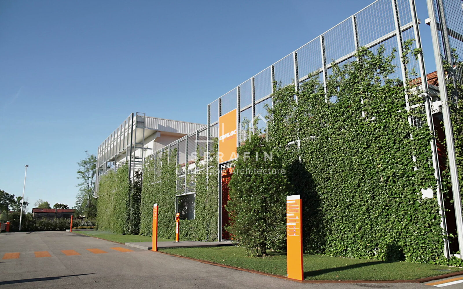 corporate green space with lawn, flower beds and a vertical green wall - 4