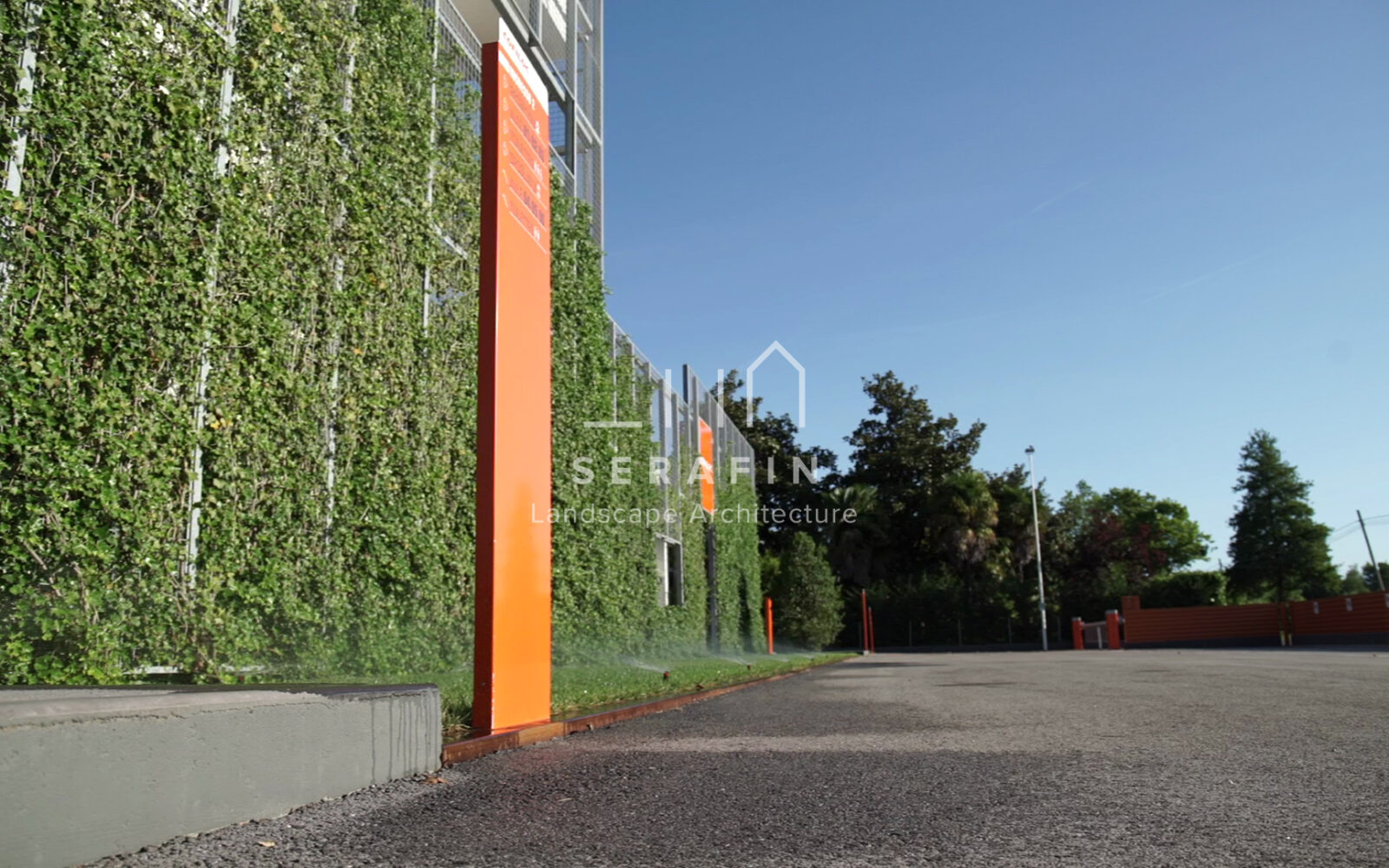 corporate green space with lawn, flower beds and a vertical green wall - 5