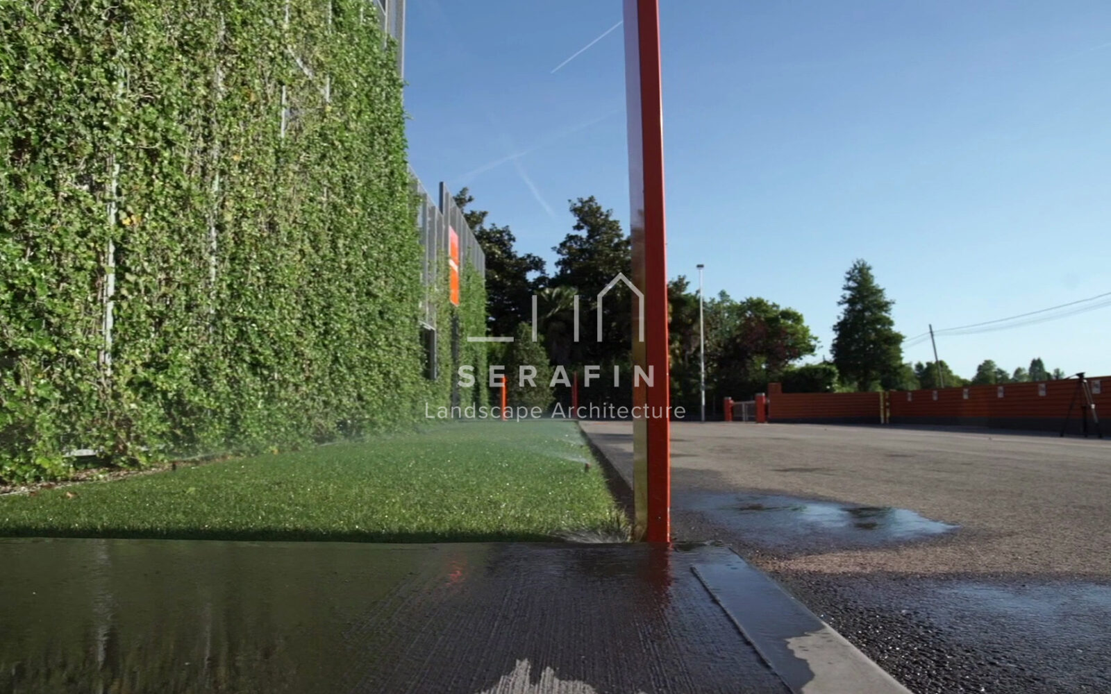 corporate green space with lawn, flower beds and a vertical green wall - 7