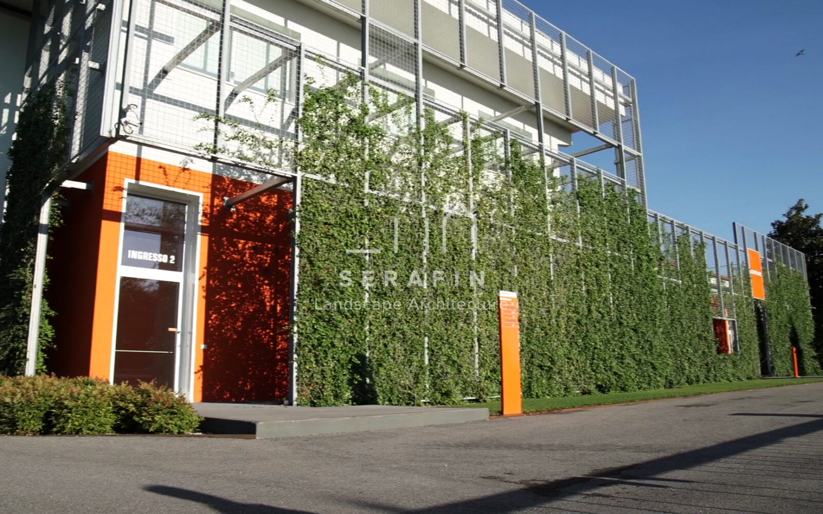 corporate green space with lawn, flower beds and a vertical green wall - 8
